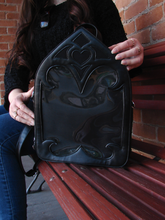 Load image into Gallery viewer, A black purse designed like a Gothic cathedral window.